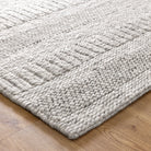 Close-up view of a grey wool and nylon area rug with a textured pattern