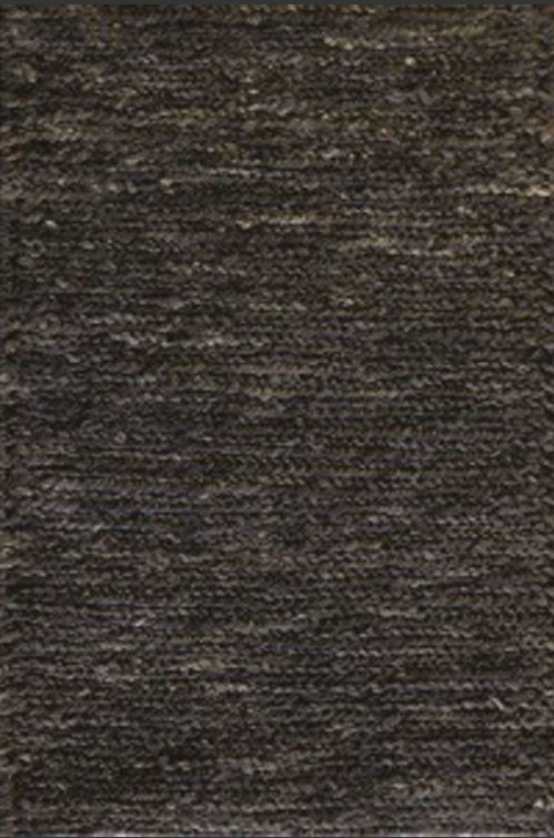 Close-up of a textured brown fabric surface