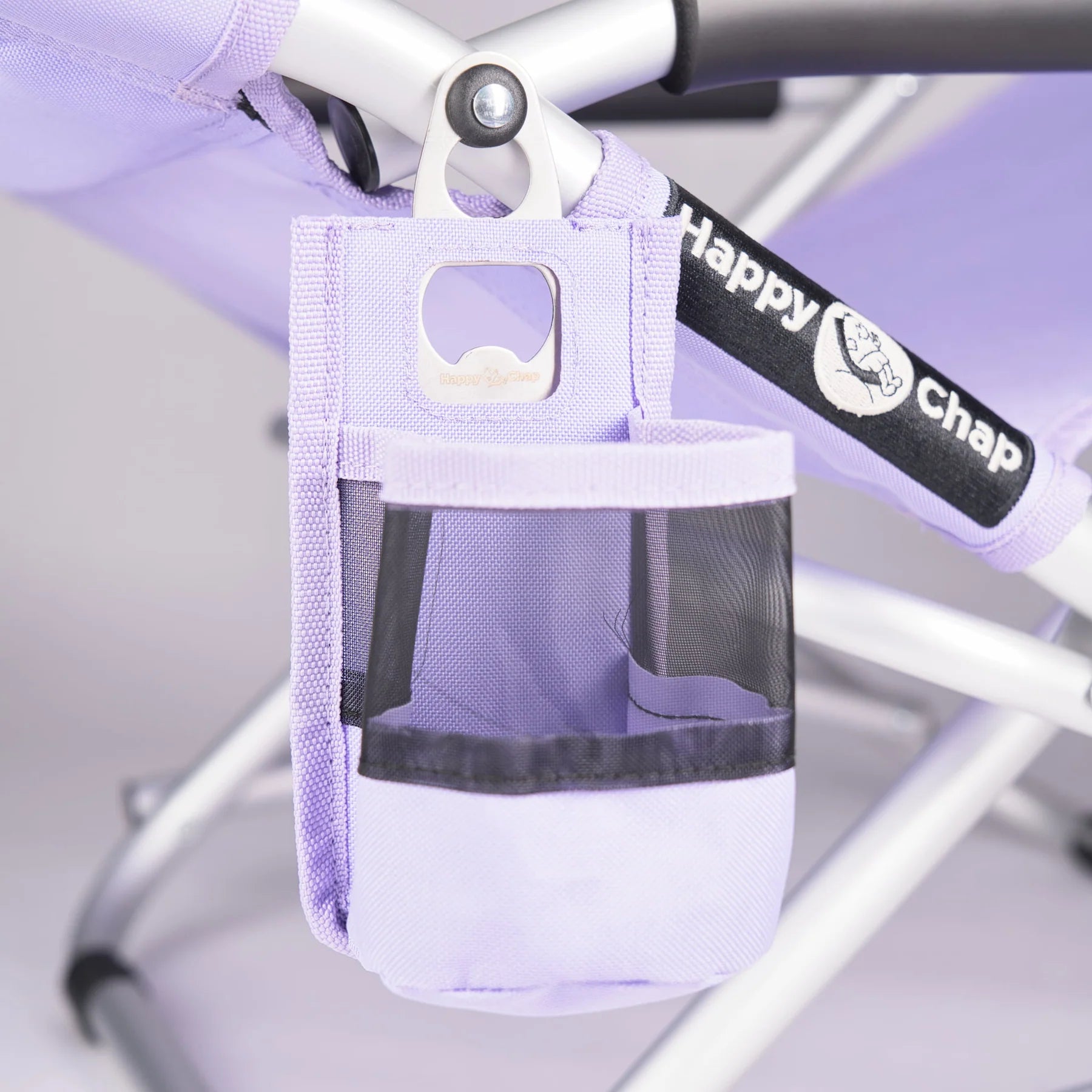 Purple bicycle bottle holder with 'Happy Chap' branding attached to a bike frame.