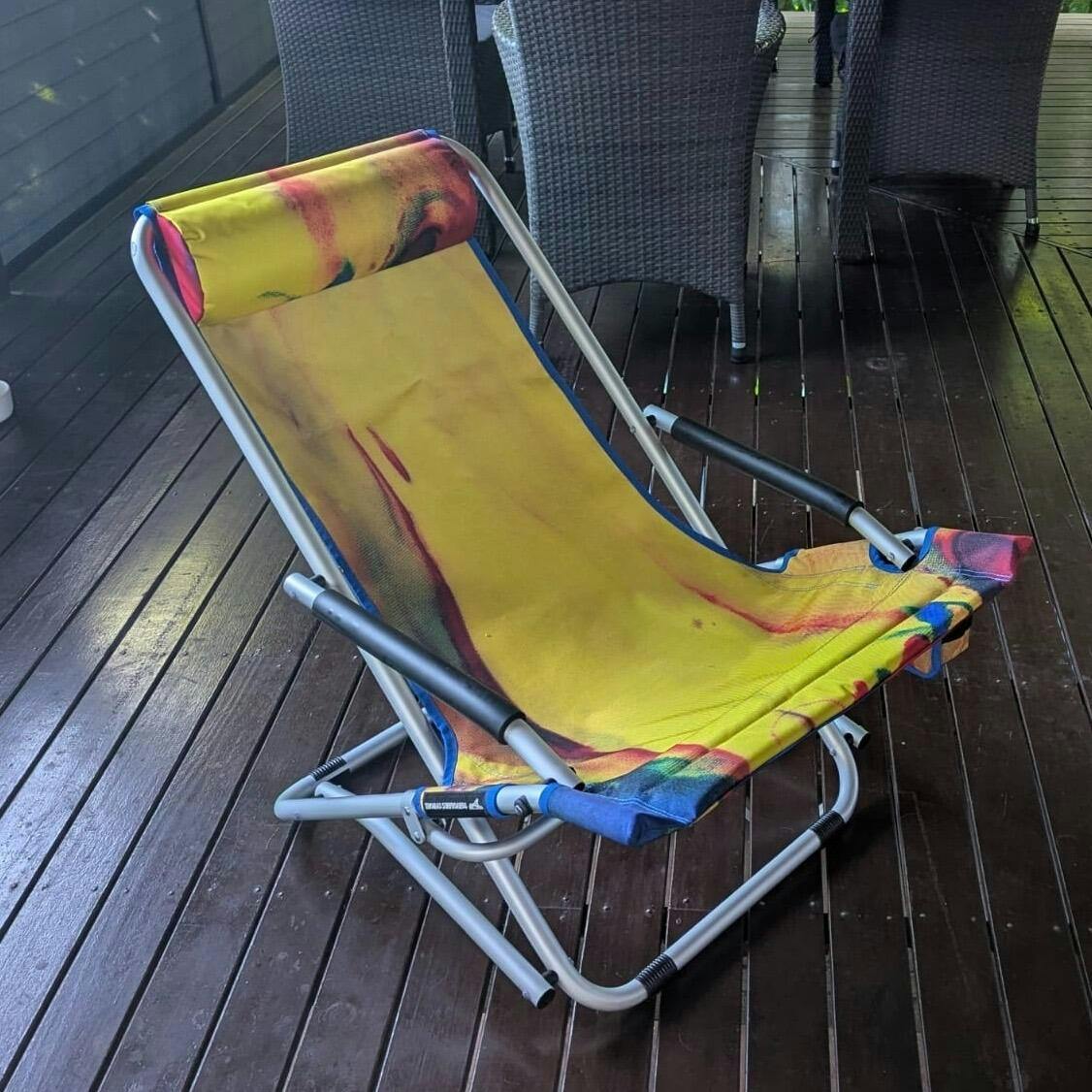 Colorful folding chair on a wooden deck
