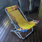Colorful folding chair on a wooden deck
