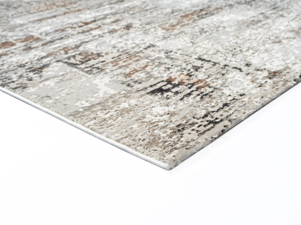 Textured area rug with a neutral color palette on a white background