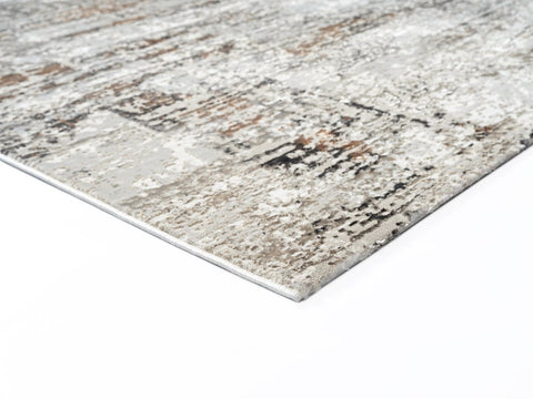 Textured area rug with a neutral color palette on a white background