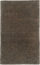 A textured wool rug in an emerald grey color with a plush, chunky woven style.