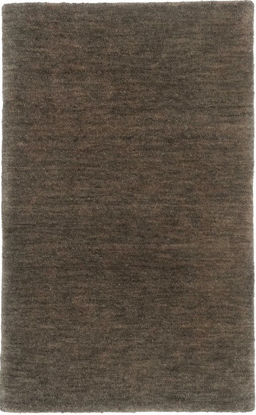 A textured wool rug in an emerald grey color with a plush, chunky woven style.