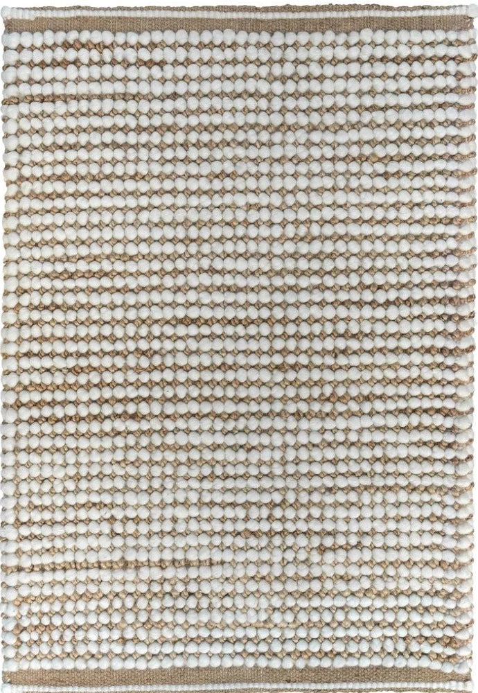 Focusing on the hand-woven details, this image captures the skilled craftsmanship of the rug and the striking contrast between the natural jute and white wool, illustrating the rug's quality and aesthetic appeal.
