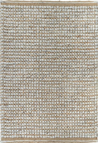 This image focuses on the fine details of the rug, highlighting the interplay between the natural and silver colors, and showcasing the unique texture created by the blend of wool and jute.