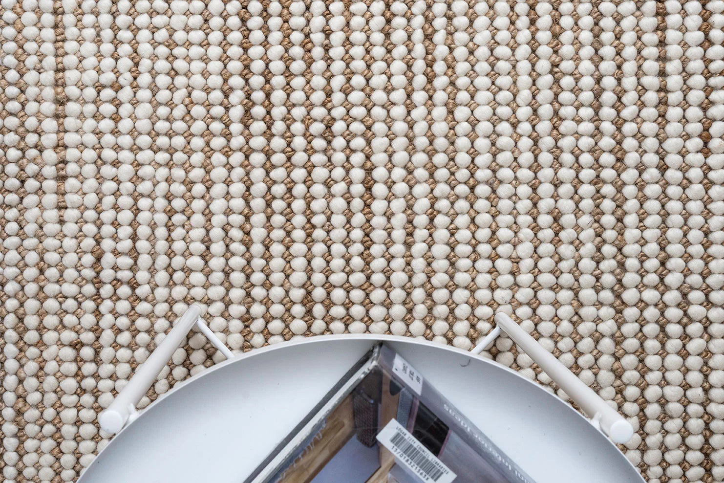 An image depicting the rug in a living space, illustrating how its earthy tones and contemporary design seamlessly integrate with various interior styles, adding warmth and character.