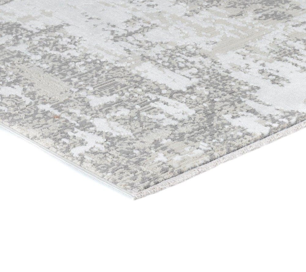 Gray and white patterned rug on a white background