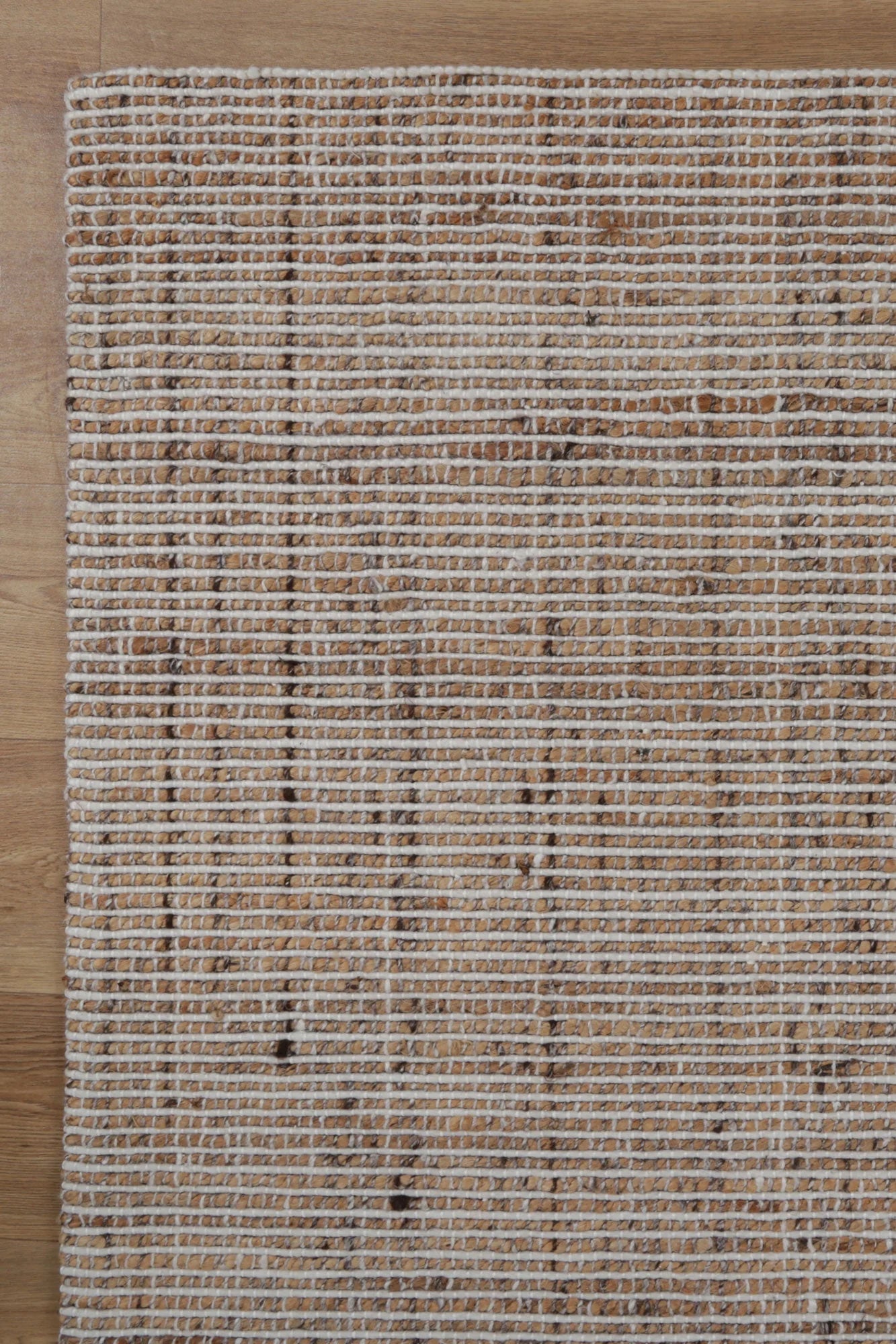 Zoomed-in view of the Dune Rug's hand-knotted weave, illustrating the intricate craftsmanship and quality.