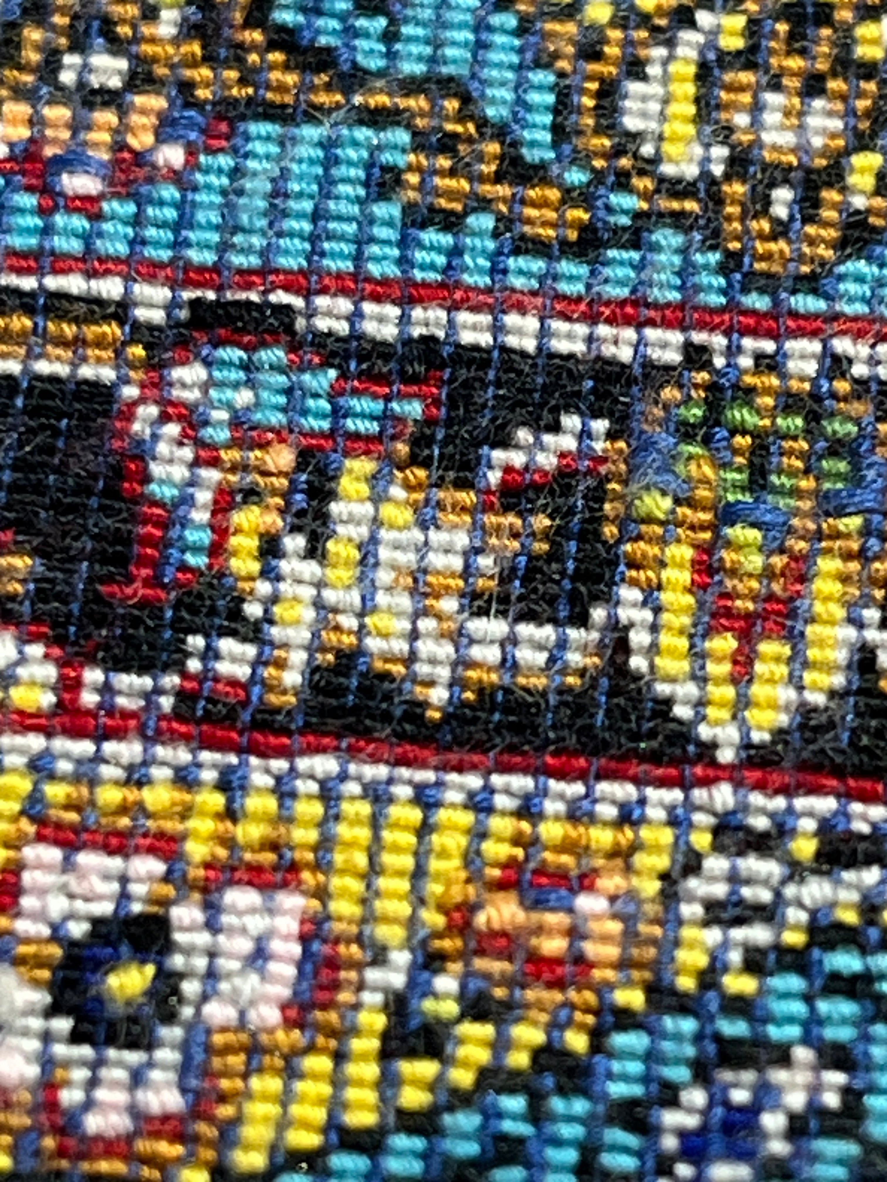 Close-up of a colorful woven fabric with patterns