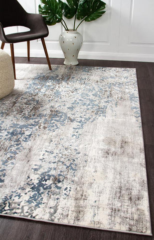 The Kendra Grey Rug elegantly placed in a modern room, exemplifying its contemporary glamour and cooling colour palette.