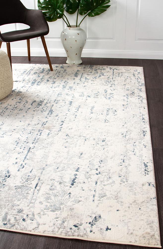 The Kendra White Rug elegantly displayed in a contemporary room setting, accentuating its modern elegance and timeless appeal.