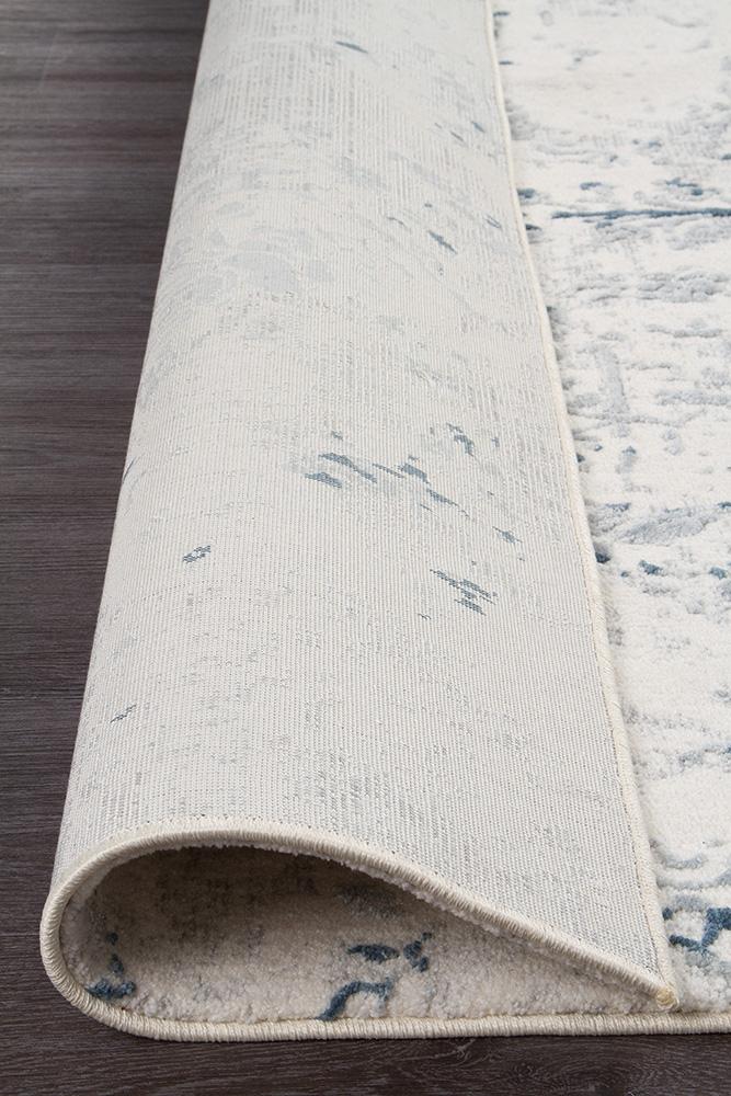 Focused image on the Kendra White Rug's vintage wash effect, giving it a unique charm and the feel of a handmade heirloom.