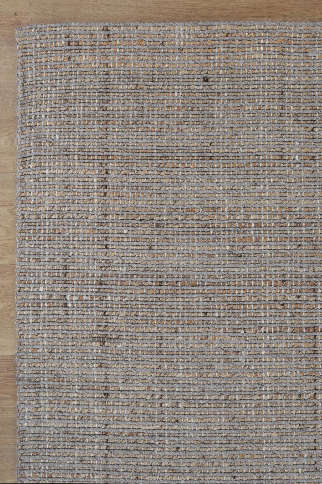 Detailed close-up of the Dune Light Grey Rug's texture, highlighting the intricate mix of jute and wool fibers.