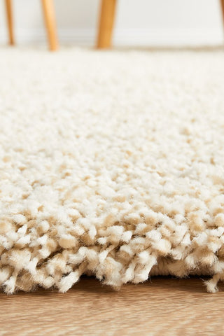 Zoomed-in view displaying the non-shedding fibers and stain-resistant surface of the Laguna Rug in Cream.
