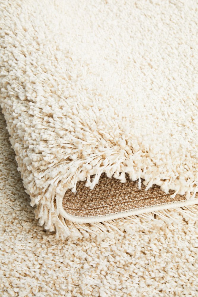 The Laguna Rug in Cream under natural lighting, emphasising the depth and warmth of its cream hue.