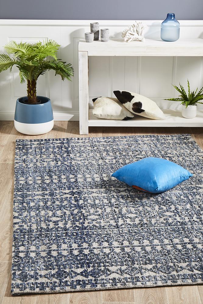 The Levi Collection Rug displayed in a home environment, illustrating how its blue and grey tones complement modern interior decor.