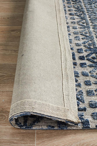 Rolled-up view of the Levi Collection Rug, highlighting its thickness and plush pile, ideal for easy handling and storage.