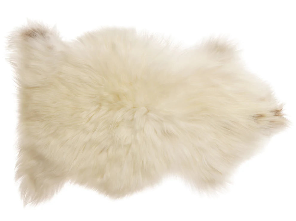 White fur rug on a white background