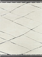 Close-up of a textured white and black rug with geometric pattern