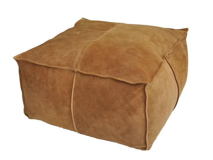 Brown suede ottoman on a white background