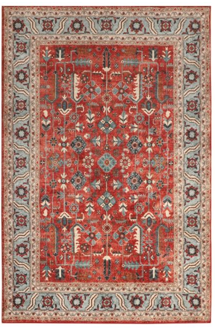 Decorative red rug with intricate patterns on a plain background