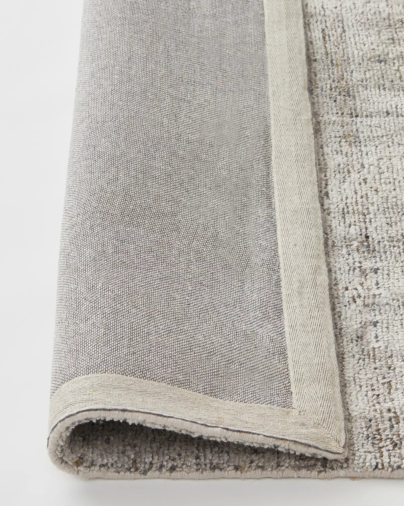 Angle shot focusing on the luxurious and soft surface of the rug, ideal for low-traffic areas in the home.
