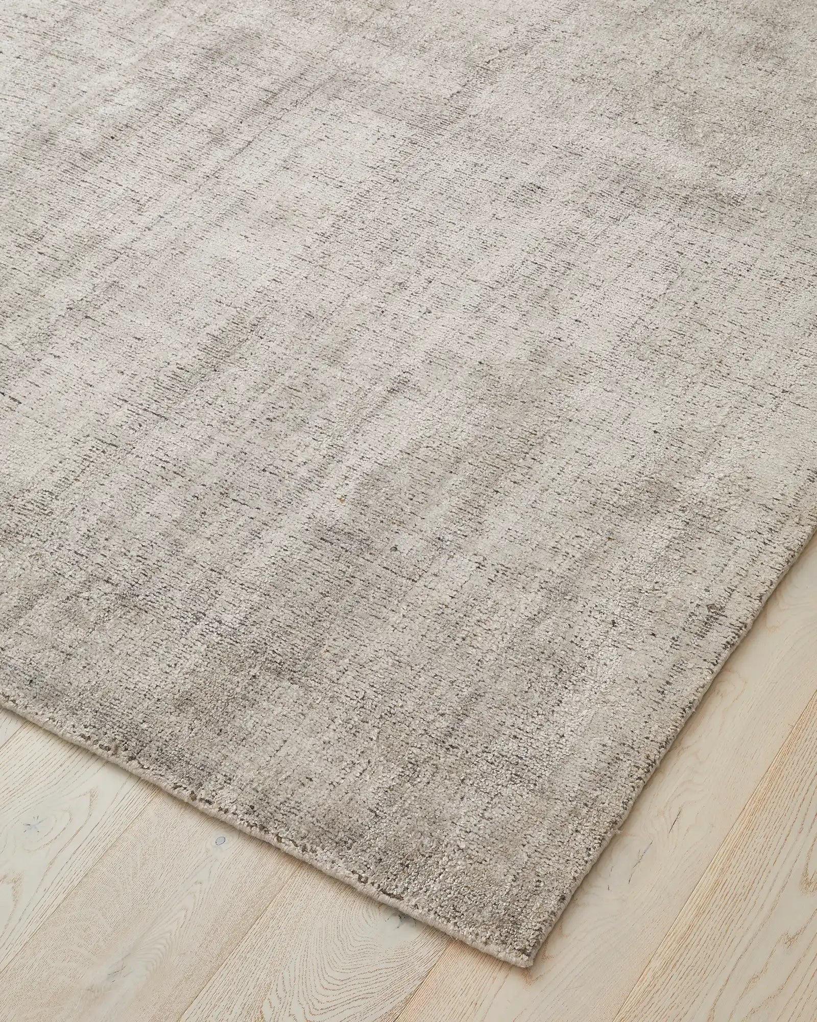 Close-up image highlighting the texture and weave of the rug, emphasising the blend of viscose and wool materials.