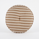 A round floor pouf cushion with horizontal brown and beige stripes, featuring a buttoned center and a stitched edge, shown on a plain white background.