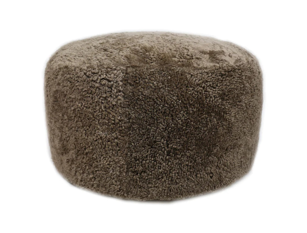 Brown textured ottoman on a white background
