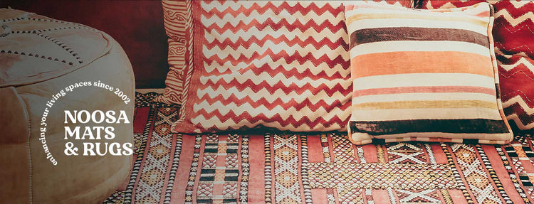 A luxurious, elegantly designed rug, highlighting the brand's commitment to quality and style, set against a backdrop that captures the essence of the Sunshine Coast's serene beauty