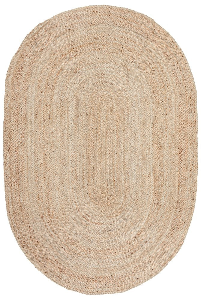 Beige braided rug on a white background
