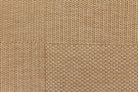Close-up of a textured beige fabric surface