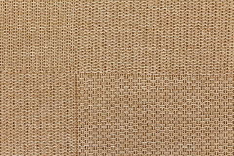 Close-up of a textured beige fabric surface