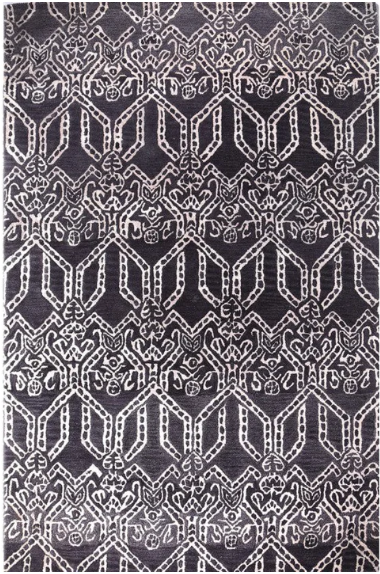 Patterned rug with geometric design on a dark background