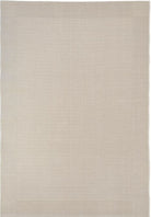Beige area rug with a subtle pattern on a plain background