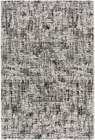 A square area rug with an abstract distressed pattern in shades of gray, black, and off-white.