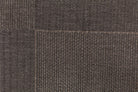 Close-up of brown textured fabric with a visible seam.