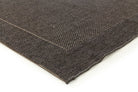 Close-up of a brown textured fabric on a white background