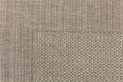 Close-up of a textured beige fabric surface