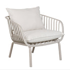 A modern outdoor lounge chair with a light gray metal slatted frame and thick off-white cushions, shown against a plain white background.