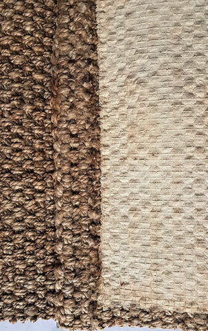 Close-up of brown and beige textured carpet samples.