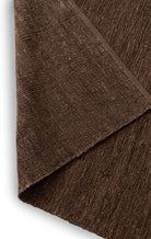 Close-up of brown fabric with a textured pattern
