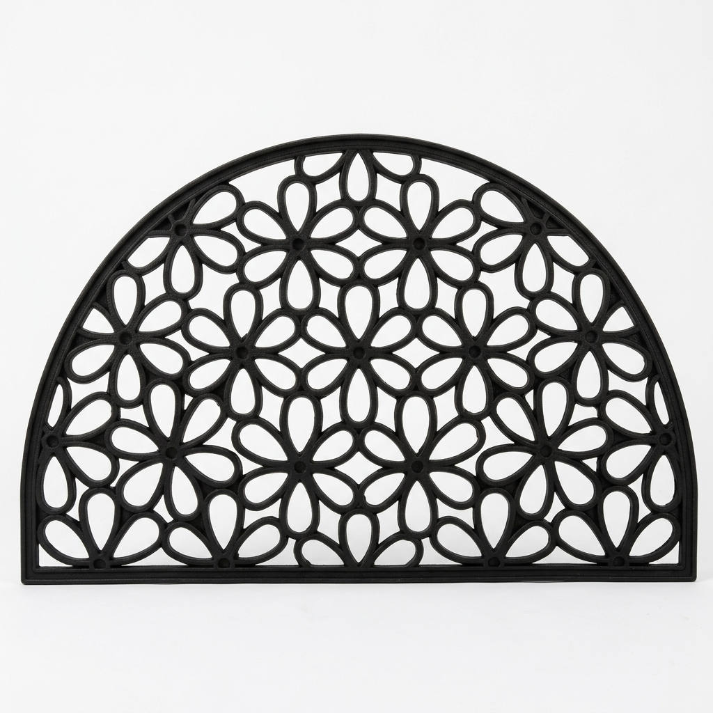 A black arched doormat with an intricate geometric floral cutout pattern, shown against a plain white background.