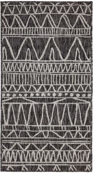 Patterned rug with geometric design on a black background