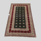 Decorative rug with intricate patterns on a plain background