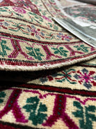 Close-up of a patterned rug with intricate designs.