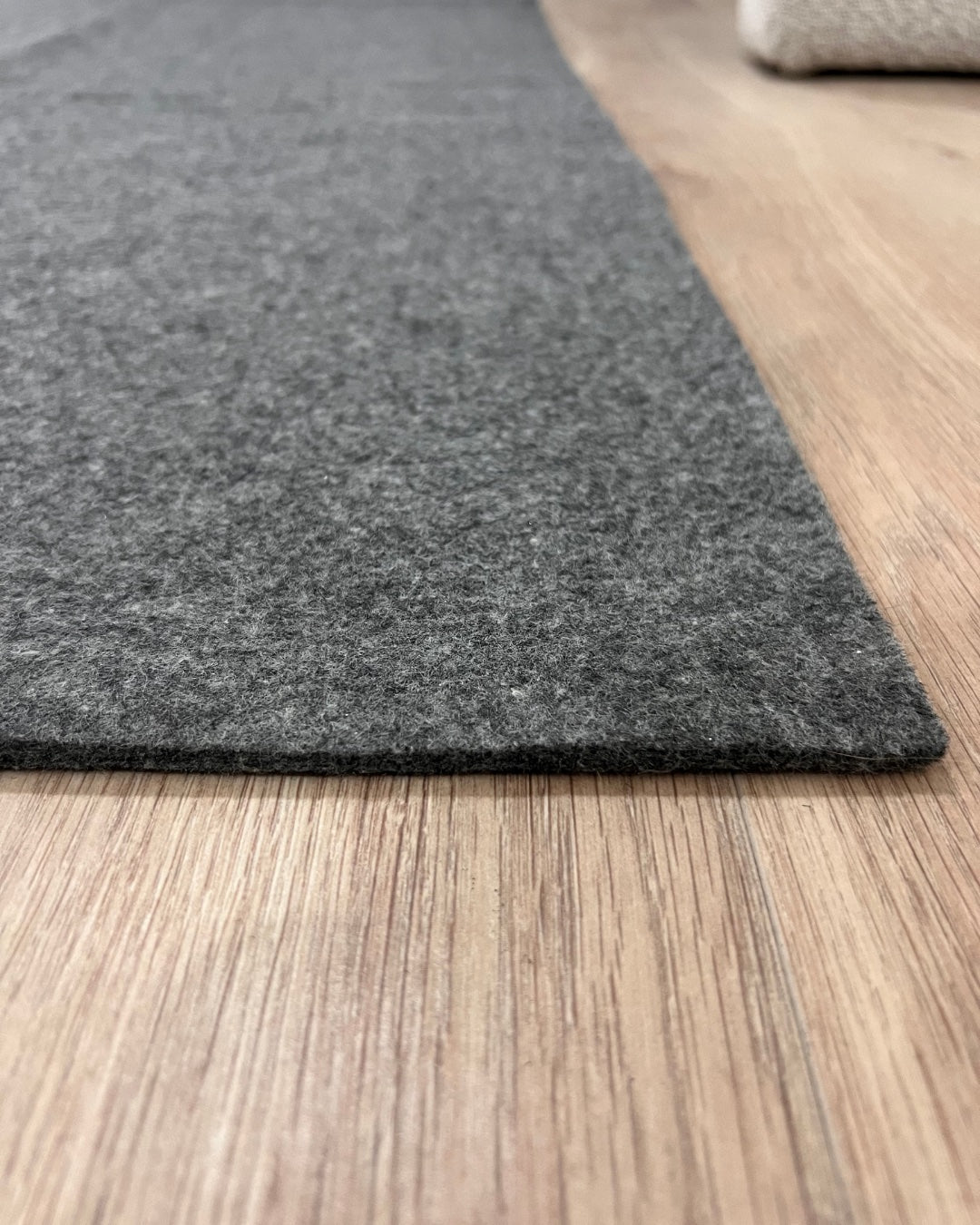 Gray rug on a wooden floor