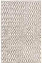 Textured beige rug with a subtle pattern
